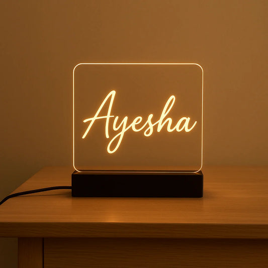 Neon sign with on a wooden table against a brown background