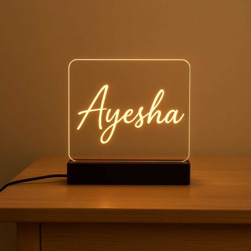 Neon sign with  on a wooden table against a brown background
