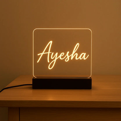 Neon sign with  on a wooden table against a brown background